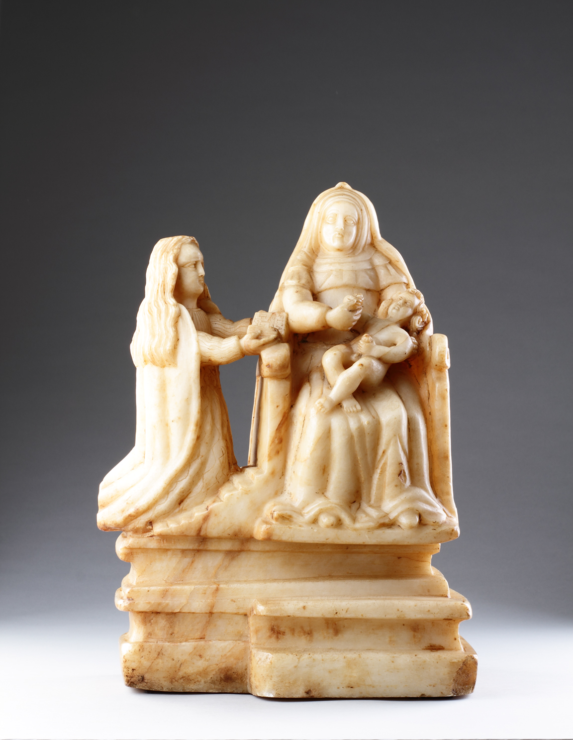 Sicilian Trapani Baroque Carved Alabaster Group Depicting Saint Anne Seated on a Throne with the Young Virgin and Christ Child